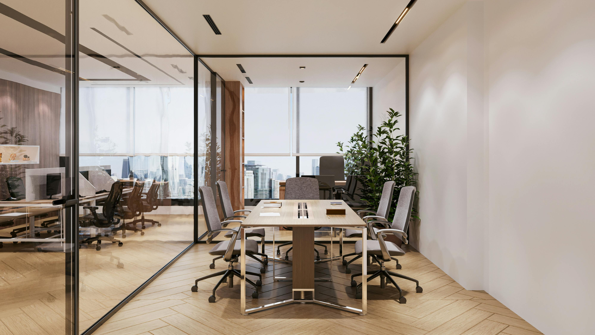 Salle de réunion et open space vitrés dans les bureaux d'une entreprise tertiaire